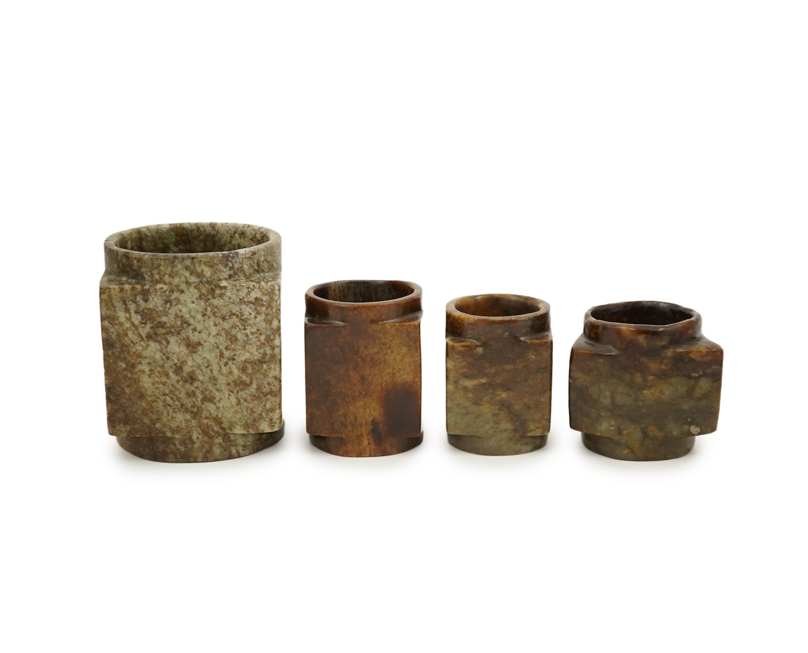 Four Chinese archaistic jade or hardstone cong
